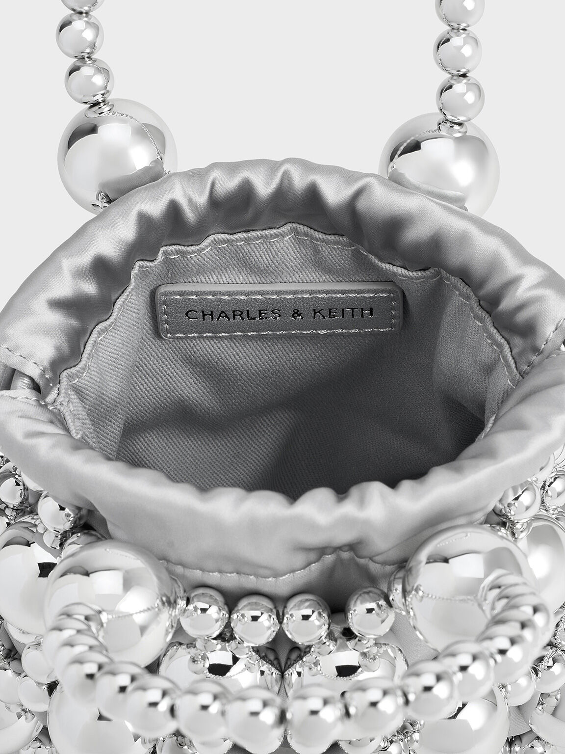 Silver Metallic Beaded Top Handle Bag CHARLES KEITH ID