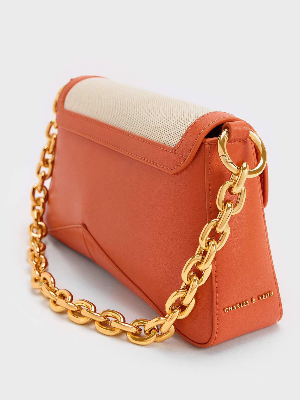 Charles and keith orange sling bag 2025