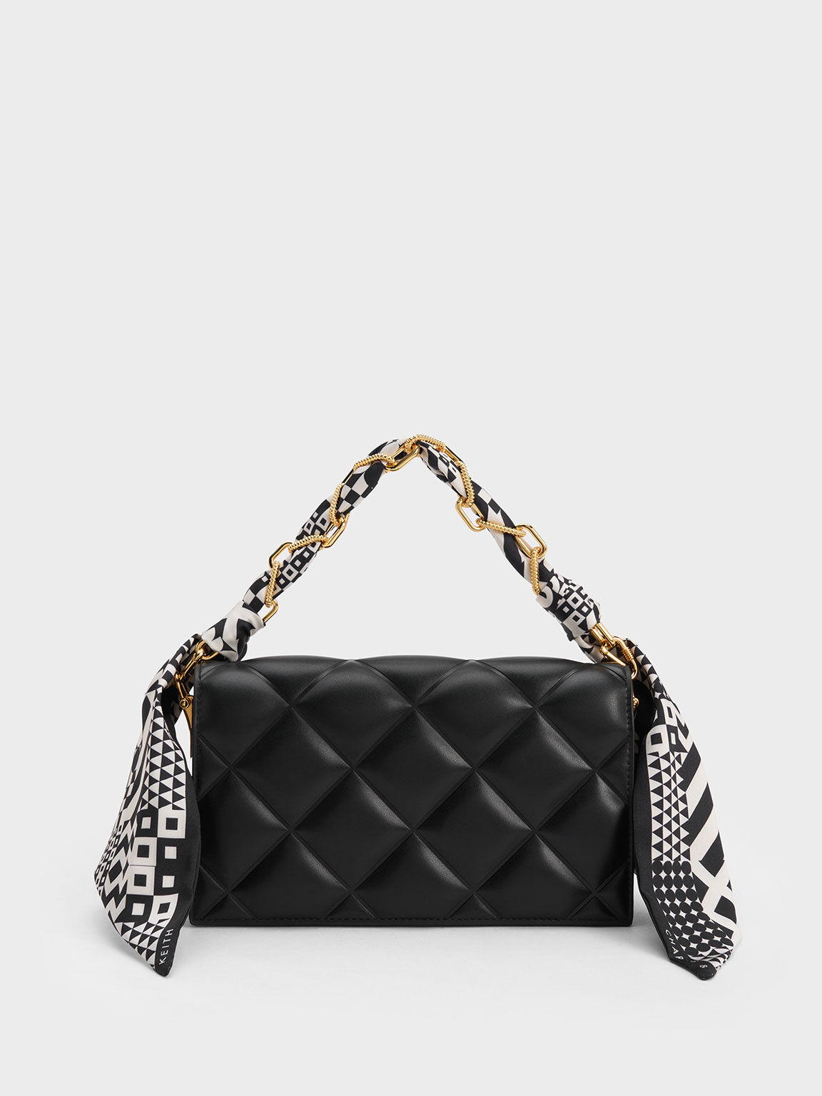 Black quilted sale clutch