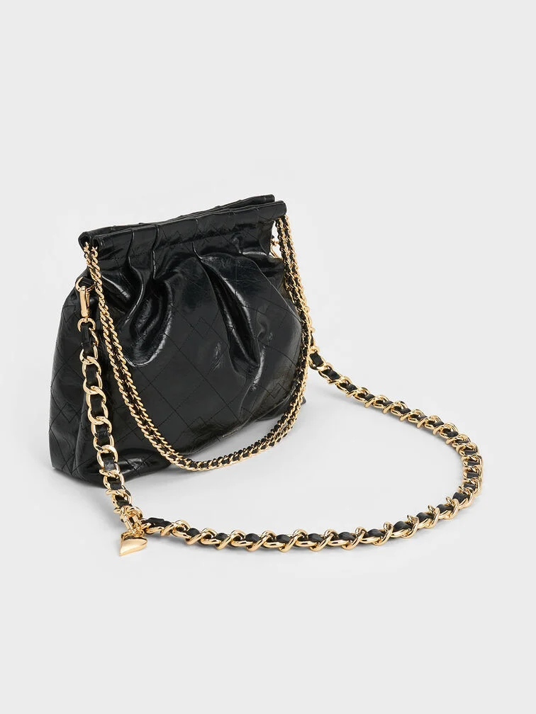 Black quilted hobo bag, perfect for the fuss-free, effortlessly stylish mum.