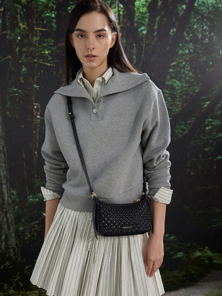 A collared shirtdress paired with a grey zip-up pullover.