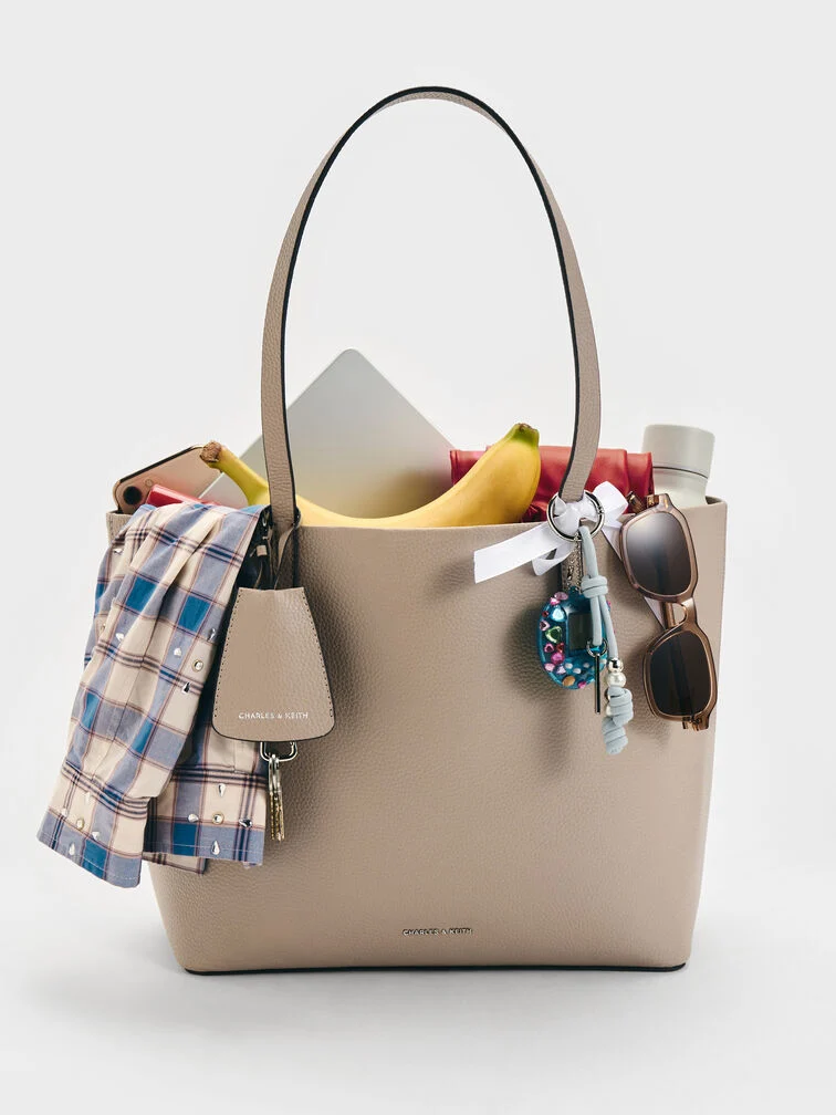 Spacious totes are practical <i>Secret Santa</i> gifts for women who carry everything. 