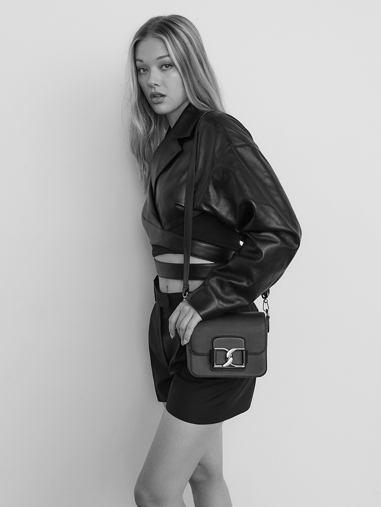 Women’s Gabine Leather Crossbody Bag in black, as seen on Jess Alexander (standing in picture) – CHARLES & KEITH