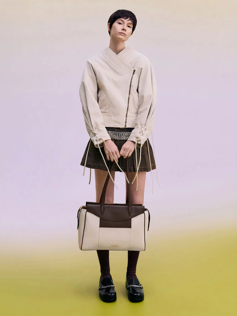 A miniskirt styled with a leather jacket for a party-ready look.