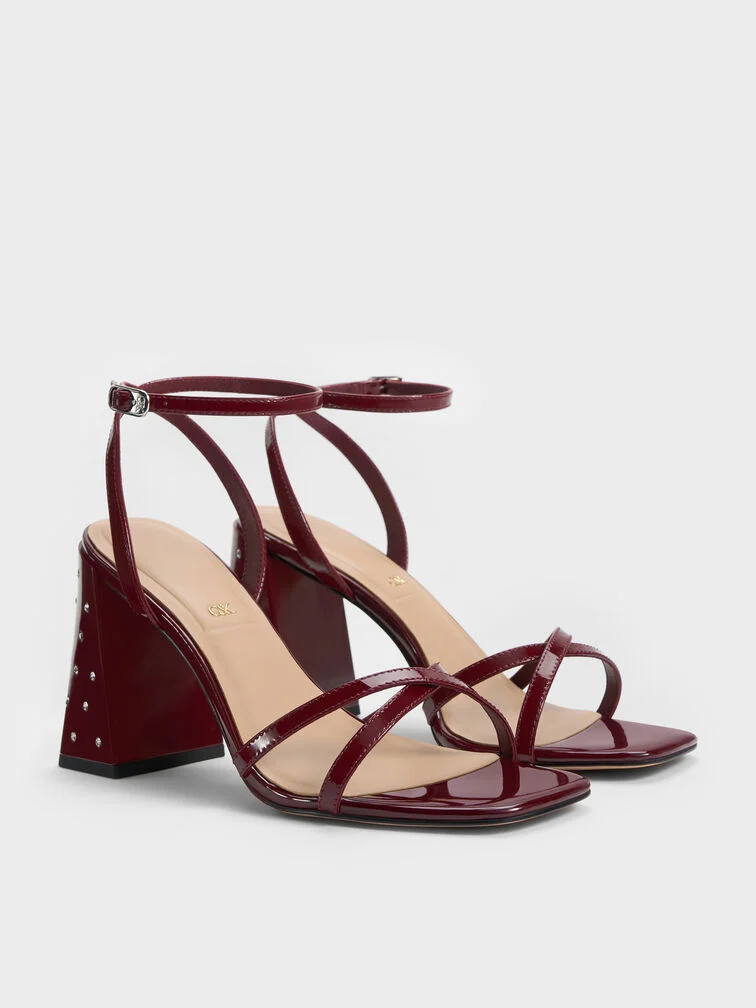 Burgundy crystal-embellished crossover sandals, the ideal footwear for a black-tie optional dress code. 