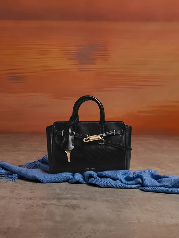 Ivette Denim Front Flap Crossbody Bag in light washed denim - CHARLES & KEITH