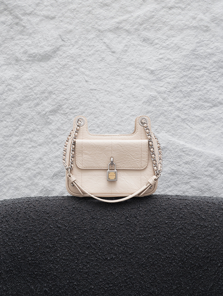 Women's Suki crinkle-effect padlock shoulder bag in oat - CHARLES & KEITH