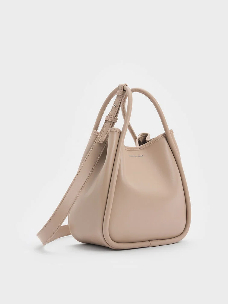 The mini Lyla tote with its opening clipped.