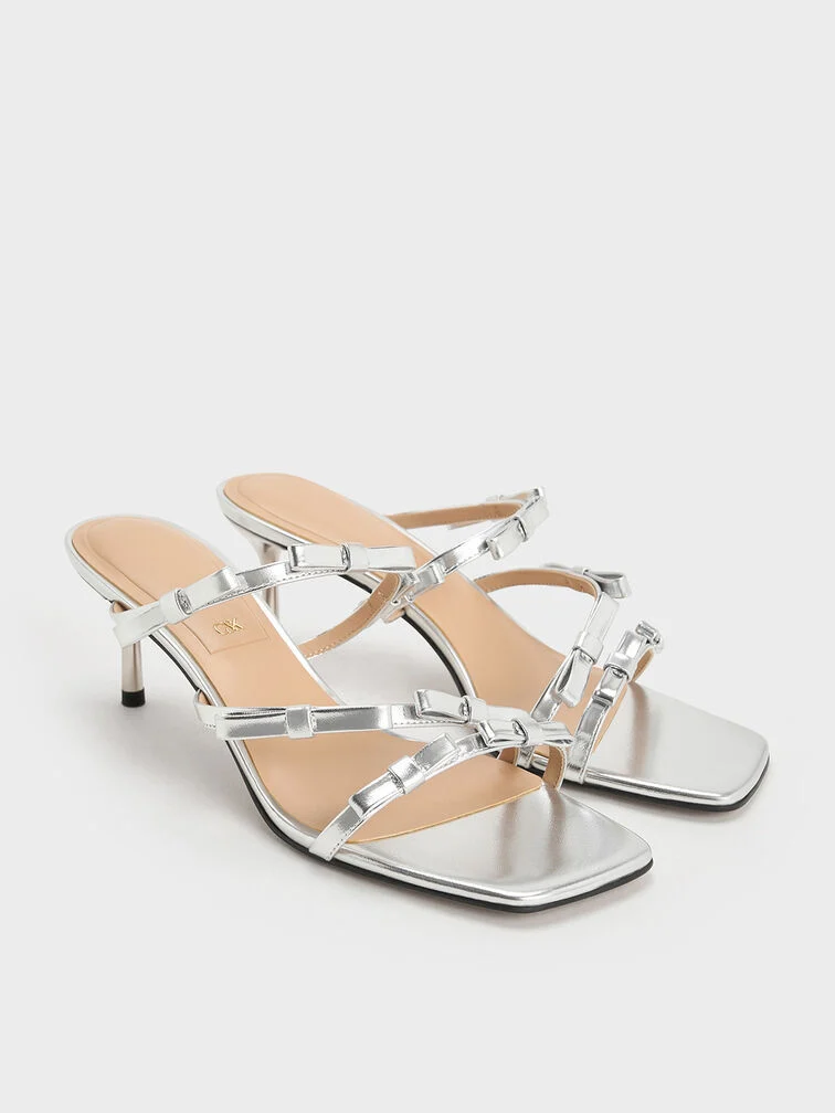 Bow-detail sandals will pair well with a cocktail dress to make a statement.