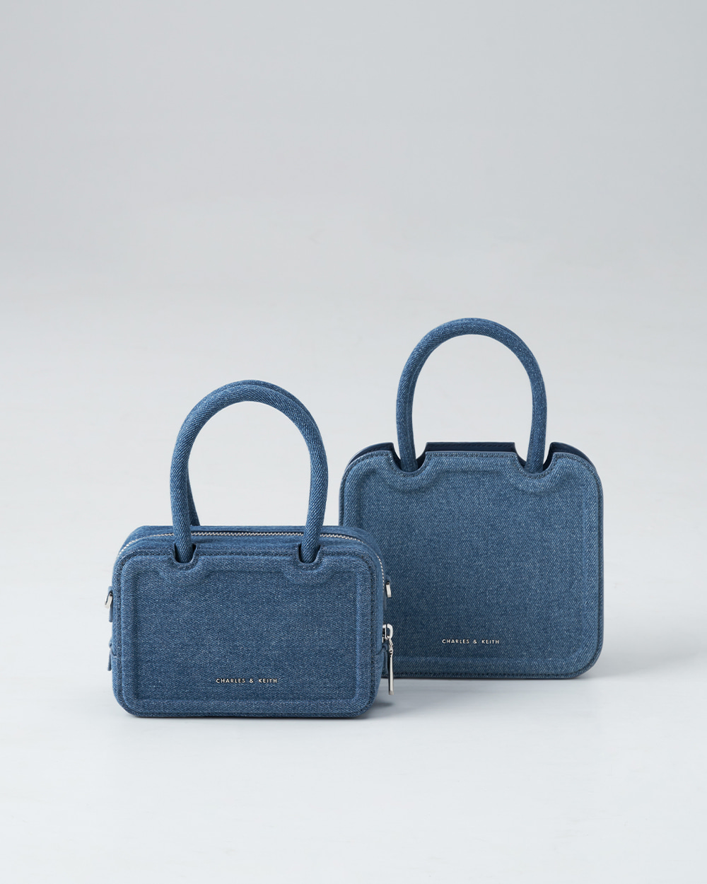 Women’s Perline denim elongated tote bag and Perline denim sculptural tote bag in denim blue  - CHARLES & KEITH
