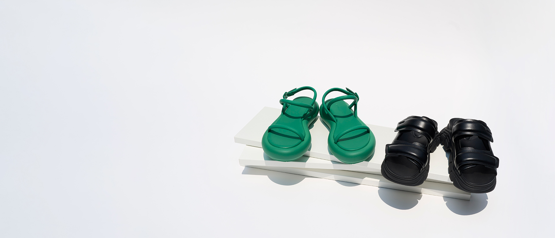 Women’s Keiko Padded Flatform Sandals in green and Dash Double Strap Slides in black - CHARLES & KEITH
