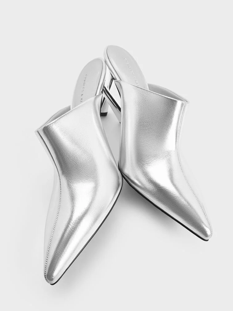 Silver mules featuring a high stiletto heel. 
