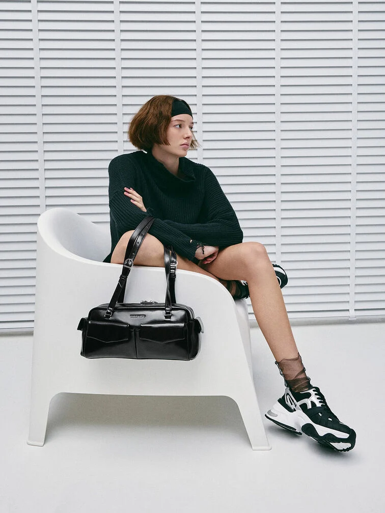 Black East–West bag with multiple pockets makes busy school days easier.