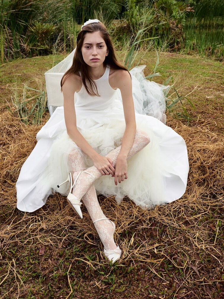 White satin ankle-strap pumps with beaded details, made for the modern bride.