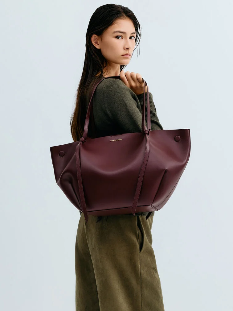 A large volume, soft tote bag delivers both function and style.