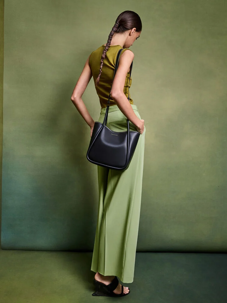 The mini Lyla can be styled as a shoulder bag with a skirt and boatneck top.