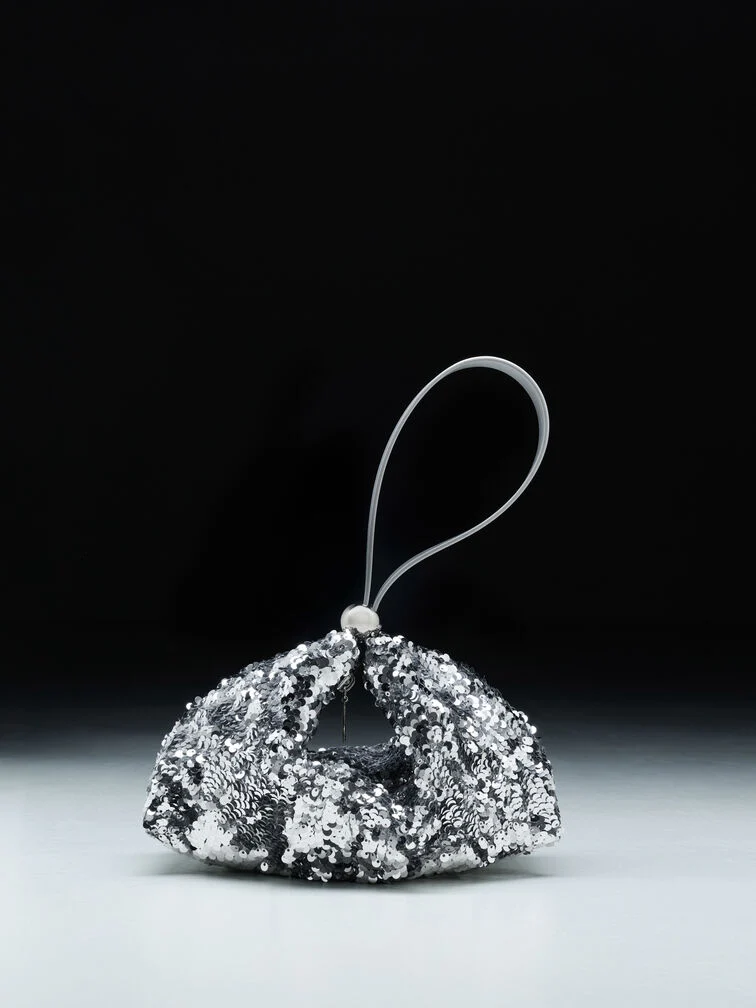 A shiny, embellished shoulder bag will suit an upscale evening wedding.