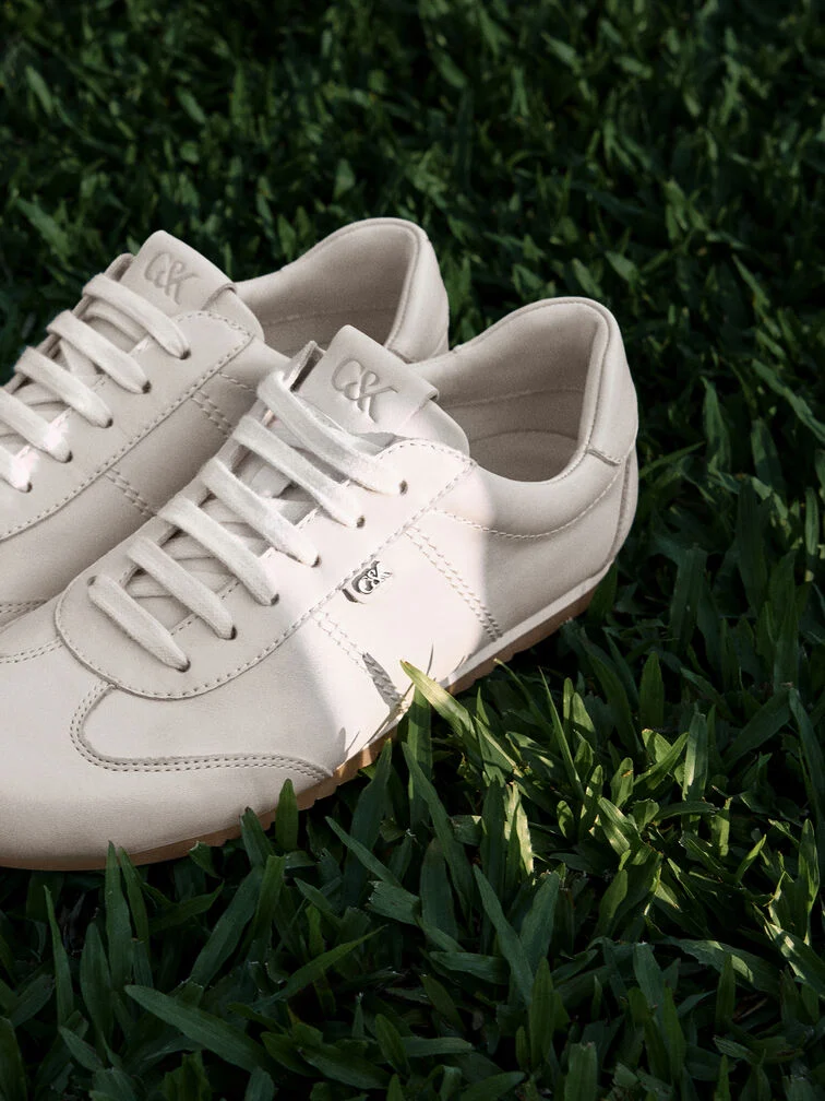 A pair of white sneakers will match with any outfit.
