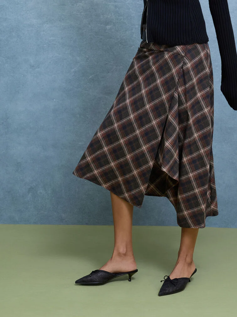 Pointed-toe kitten-heel mules combine feminine details with comfort and ease of wear.