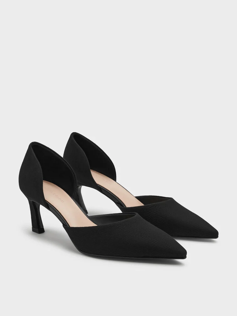  Black pointed d’Orsay pumps with chic blade heels are a wardrobe workhorse that will work well for most settings.  