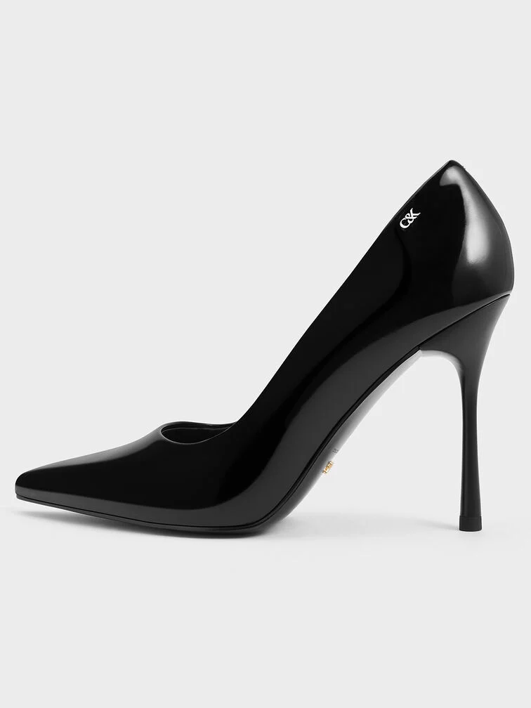 Towering pointed stiletto pumps are a wardrobe staple that makes a powerful statement. 